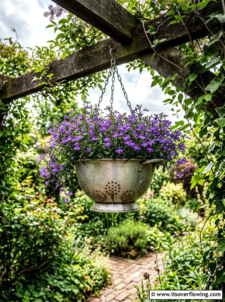 Metal colander hanging planter - 25 reusing old things ideas for garden decor