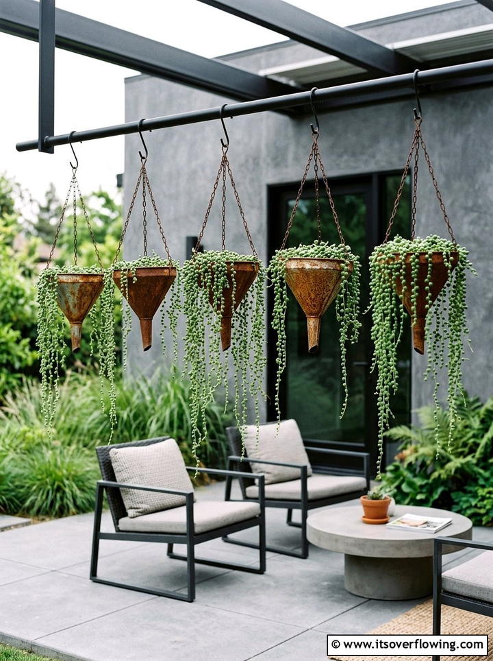 Metal funnel hanging planter - 25 upcycled garden ideas with hanging planters