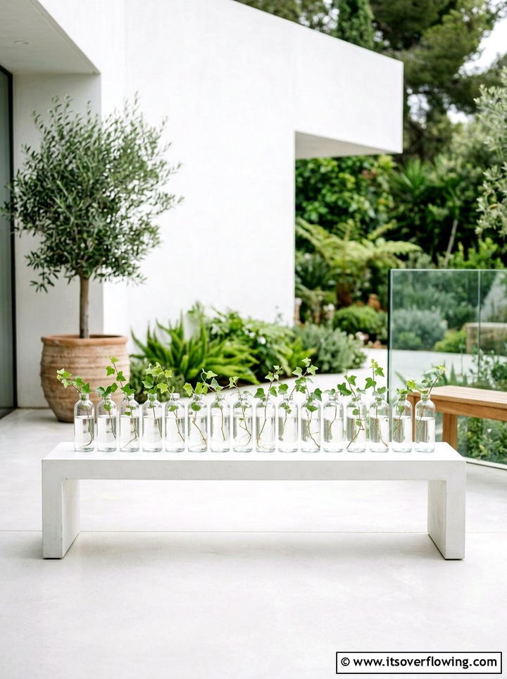 Minimalist Glass Bottle Display - 25 recycled garden ideas with hanging bottle planters