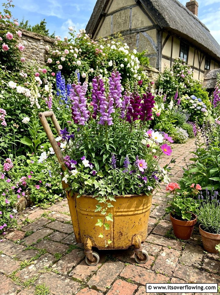 Mop bucket flower display - 25 upcycled garden ideas with old buckets