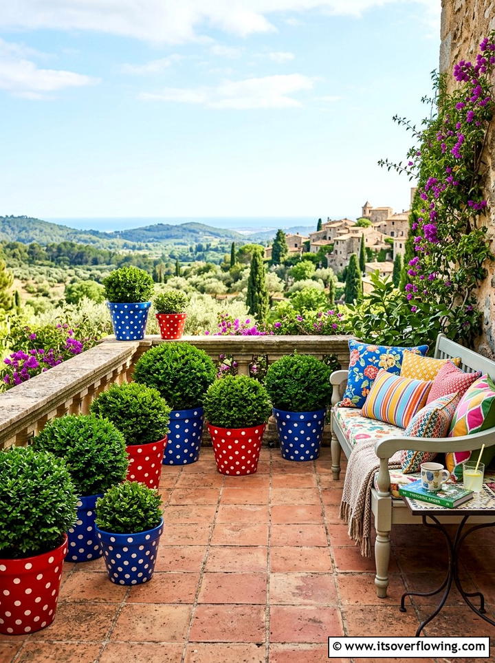 Playful terrace with polka dot containers - 25 creative garden ideas with painted planters