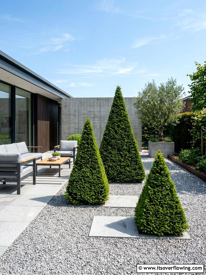 Pyramid Topiary In Gravel Courtyard - 25 garden decor ideas with topiary
