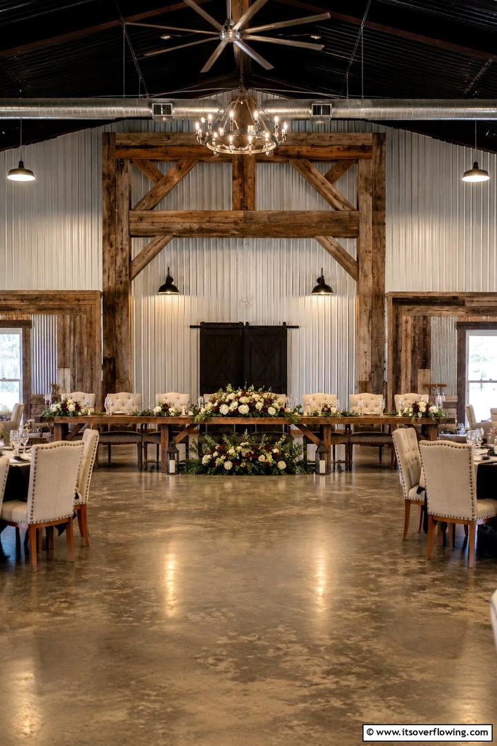 Reclaimed Wood Frame with Floral Arrangements - 30 Rustic Wedding Centerpieces for a Charming Celebration