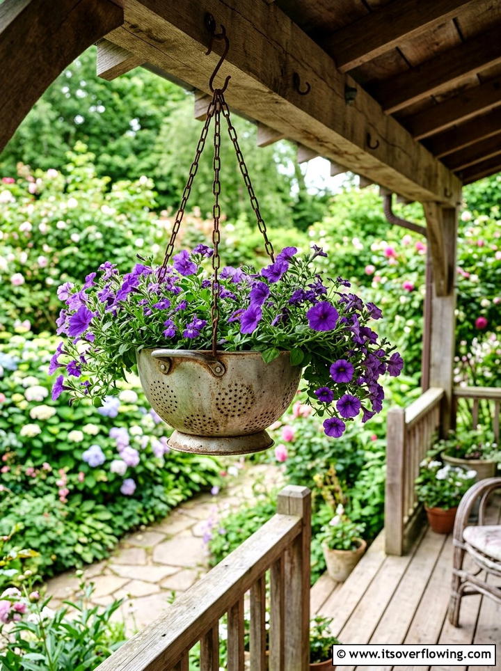 Recycled Colander Flower Basket - 25 upcycled garden ideas for schools