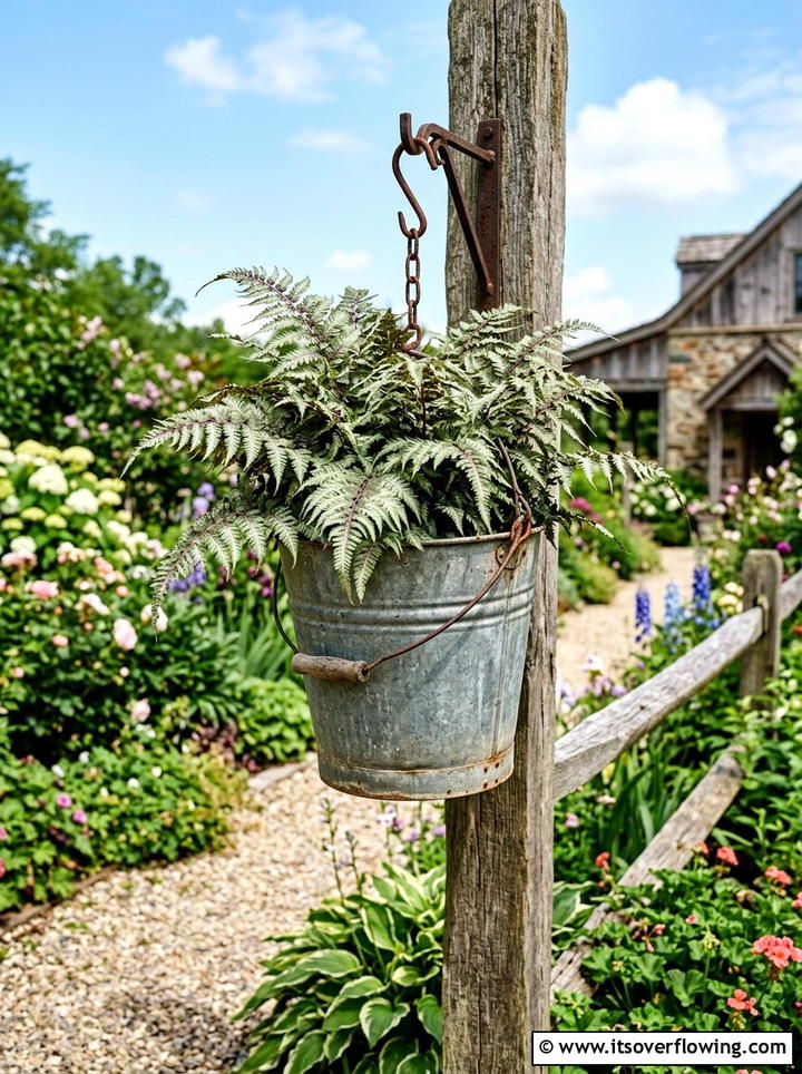 Rustic Galvanized Bucket Planter - 25 garden ideas with hanging planters