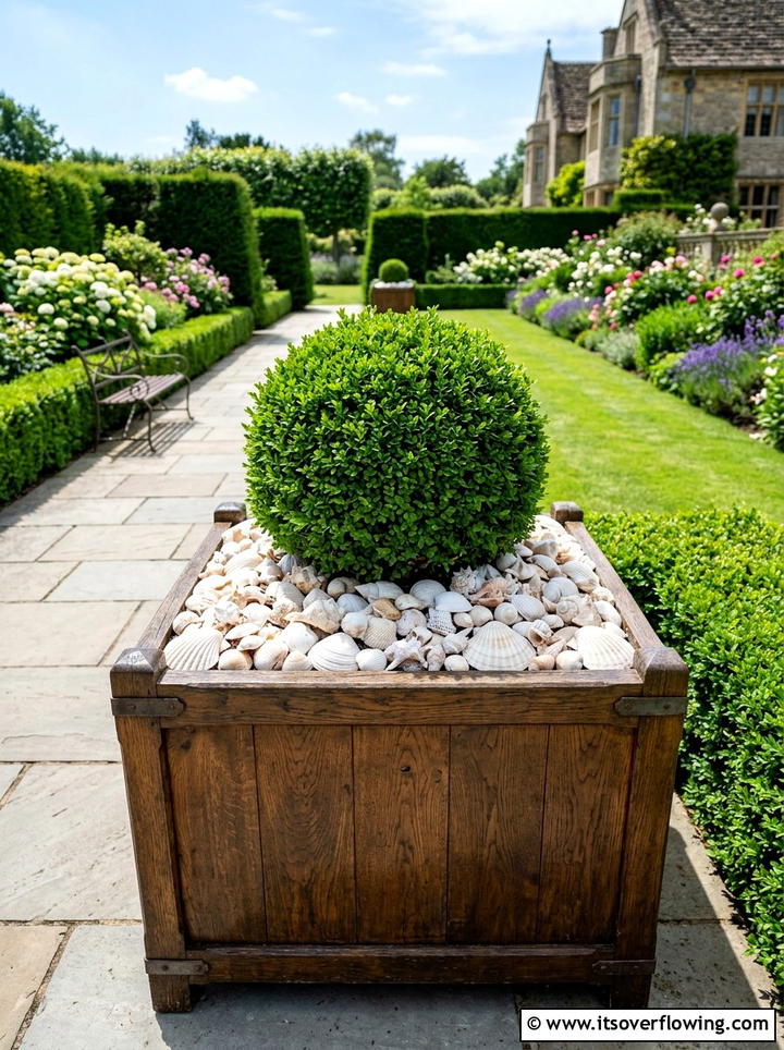 Seashell planter box filler - 25 garden decor ideas with shell accents