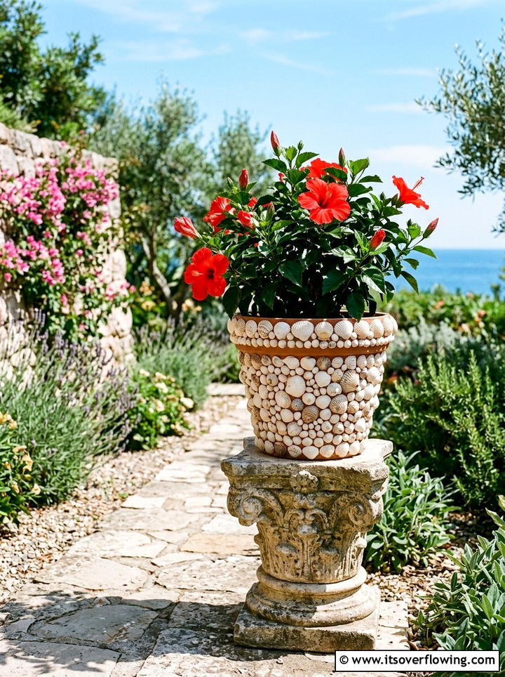 Shell covered flower pot - 25 garden decor ideas with shell accents