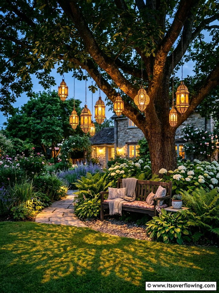 Solar lanterns hanging from trees - 25 garden decor ideas with hanging decor
