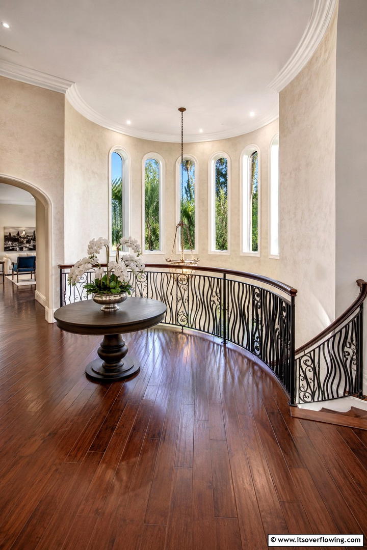 Sophisticated Curved Landing - 30 Stair Landing Ideas to Maximize Functional Spaces