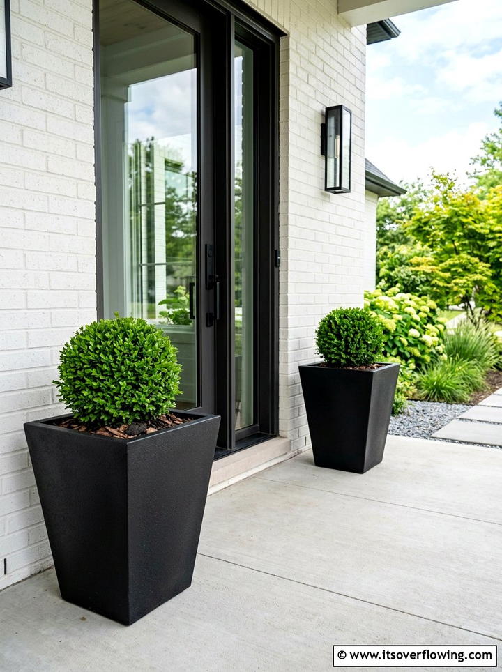 Square Tapered Black Planters - 25 front porch decor ideas with pedestal planters