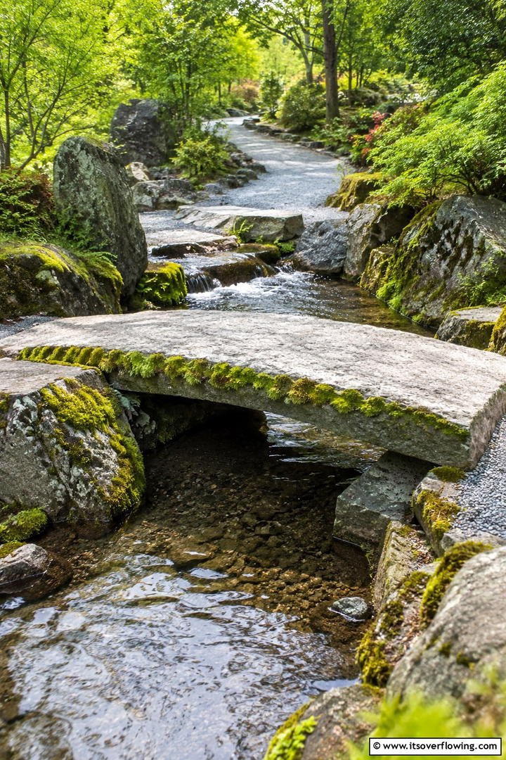 Stone Slab Bridge with Moss Accents - 20 Garden Bridge Ideas for a Serene Backyard