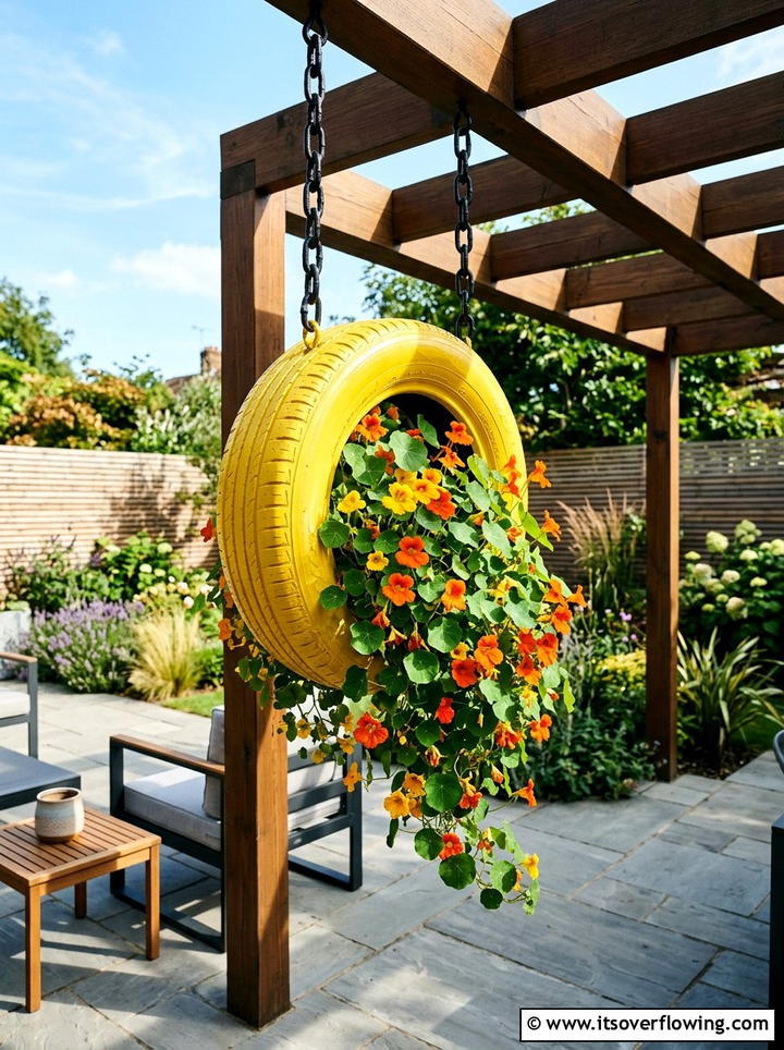 Tire hanging planter - 25 upcycled garden ideas with hanging planters