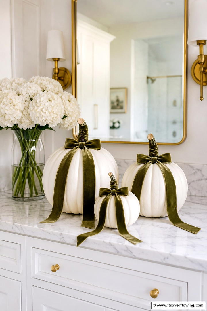 Velvet Ribbon Wrapped Pumpkin Stems - 50 Fall Pumpkin Decor Ideas for Cozy Autumn Homes Today