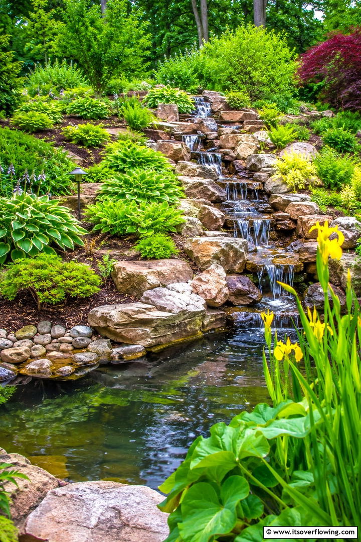 Water Feature Integrated Tiered Garden - 30 Tiered Garden Ideas for Sloped Yards and Visual Interest