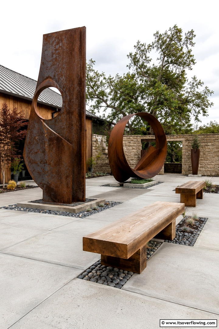 Weathered Metal Sculptures - 30 Rustic Patio Ideas for a Charming Outdoor Relaxation Spot
