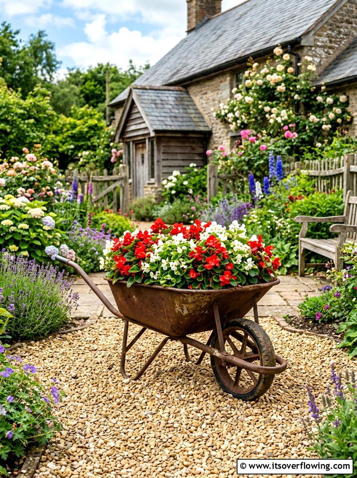 Wheelbarrow Flower Bed - 25 recycled garden ideas with pebbles