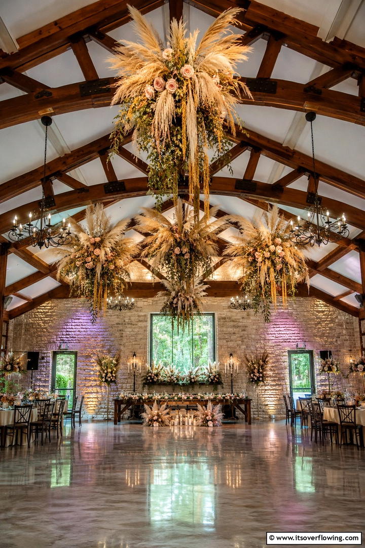 Whimsical Pampas Chandelier Accents - 30 Pampas Grass Wedding Decor Ideas for Boho Chic Vibes
