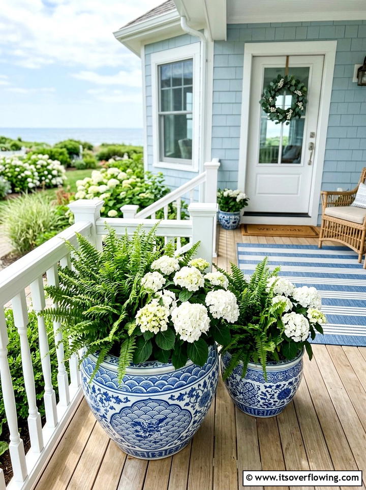 White and blue ceramic porch planter - 25 front porch ideas with painted pots
