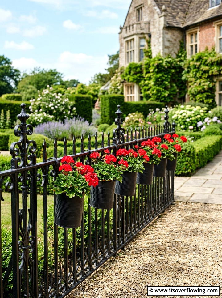 Wrought Iron Fence Planters - 25 upcycled garden ideas with tin cans