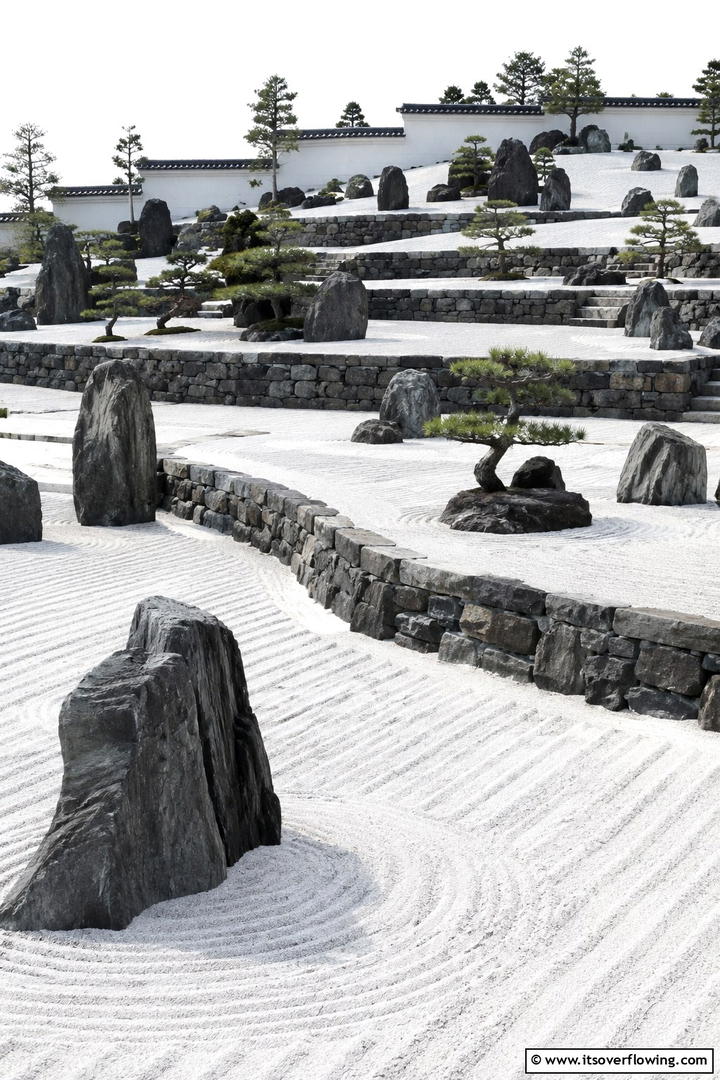 Zen Rock Garden with Tiers - 30 Tiered Garden Ideas for Sloped Yards and Visual Interest